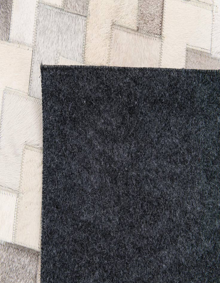 Detail image of  6' 1 x 9' Cowhide Stocks Rug