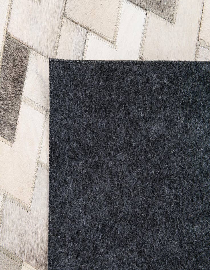 Detail image of  6' x 8' 11 Cowhide Stocks Rug