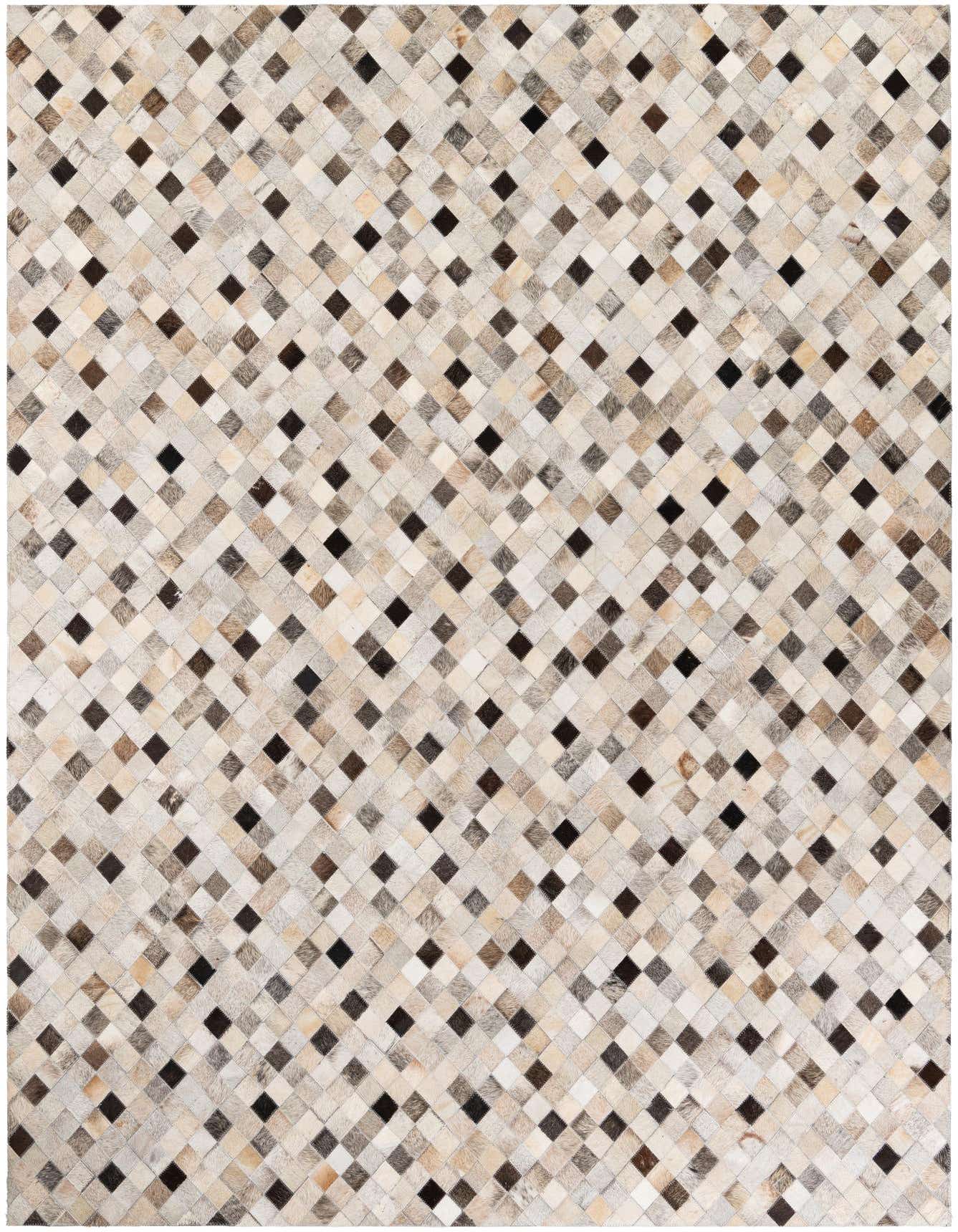 A rectangular 6x9 patchwork cowhide rug with a geometric pattern in various shades of brown, beige, and black.