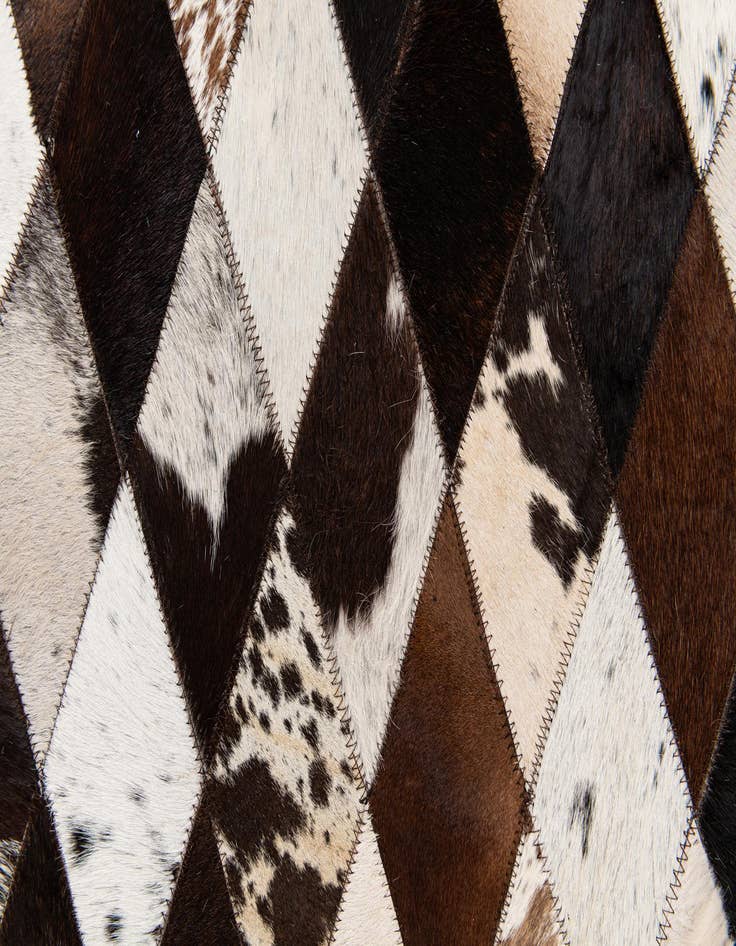 Detail image of  6' 7 x 9' 11 Cowhide Stocks Rug