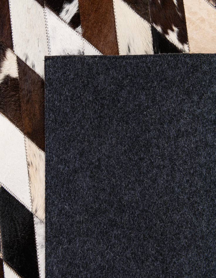 Detail image of  6' 7 x 9' 11 Cowhide Stocks Rug