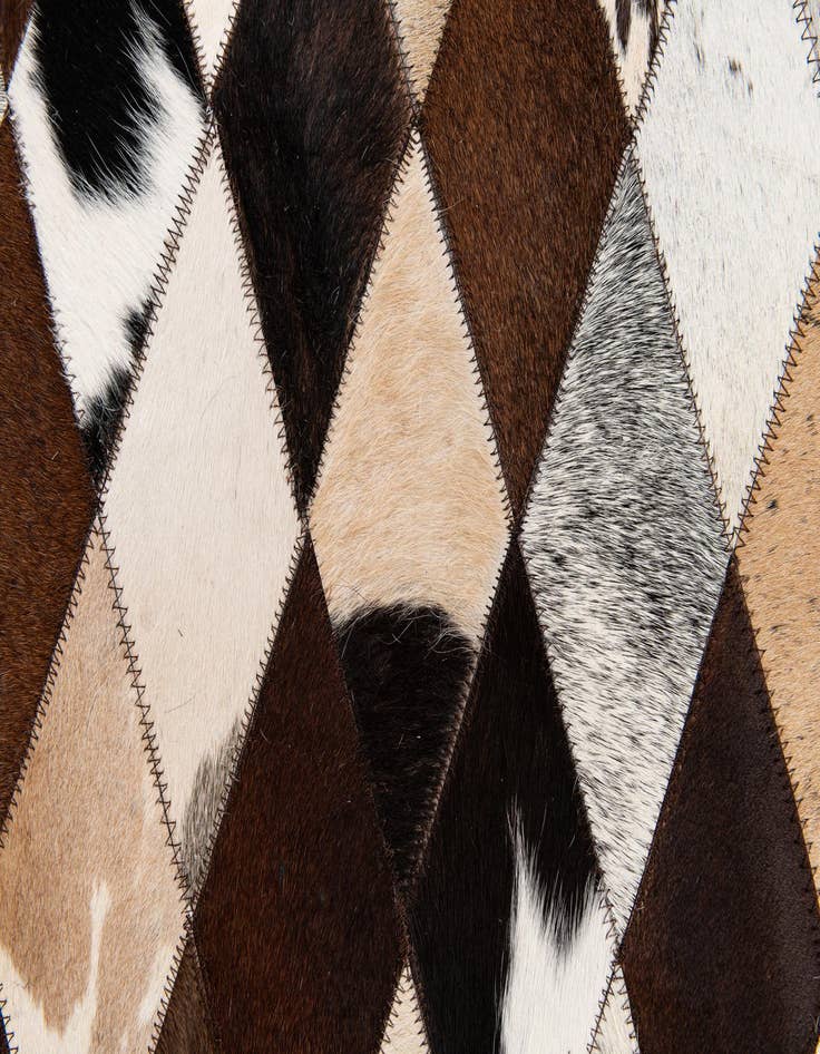 Detail image of  6' 7 x 9' 10 Cowhide Stocks Rug