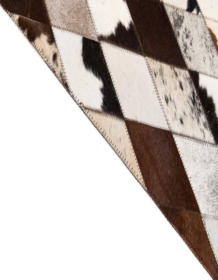 Detail image of  6' 7 x 9' 11 Cowhide Stocks Rug