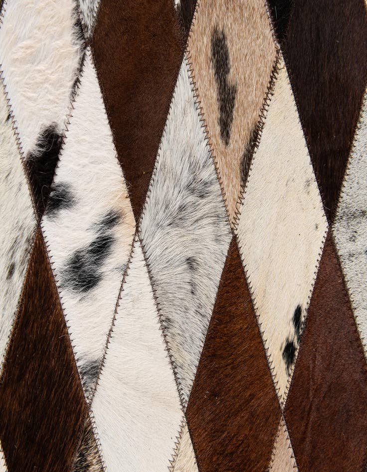 Detail image of  6' 7 x 9' 11 Cowhide Stocks Rug