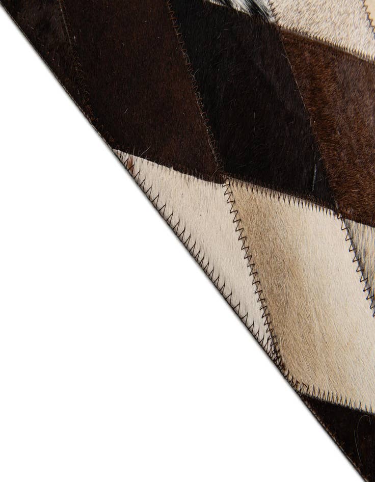 Detail image of  6' 7 x 9' 10 Cowhide Stocks Rug