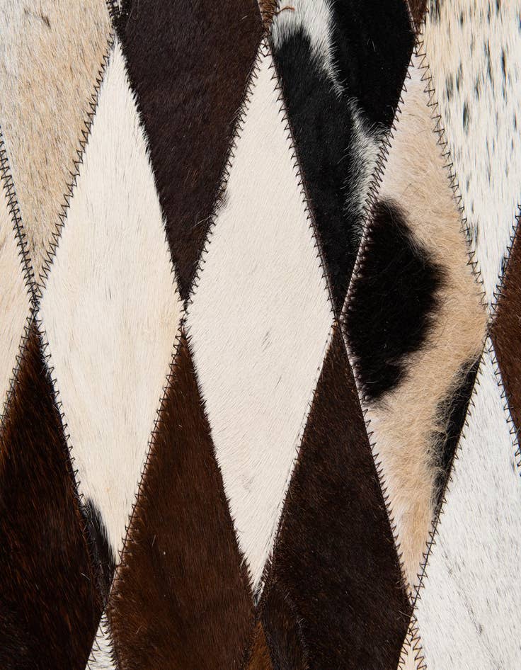 Detail image of  6' 7 x 9' 11 Cowhide Stocks Rug