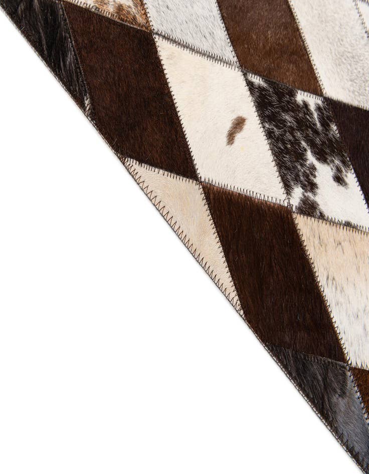 Detail image of  6' 6 x 9' 10 Cowhide Stocks Rug