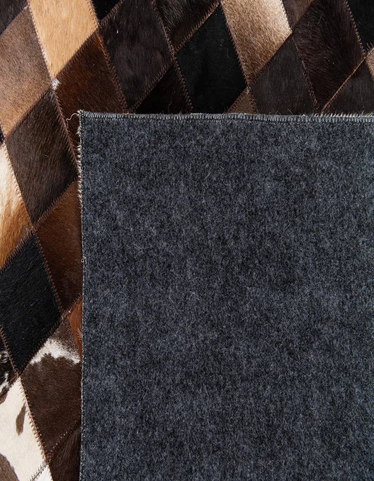 Detail image of  5' x 7' 11 Cowhide Stocks Rug