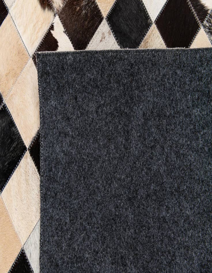 Detail image of  5' 2 x 8' Cowhide Stocks Rug