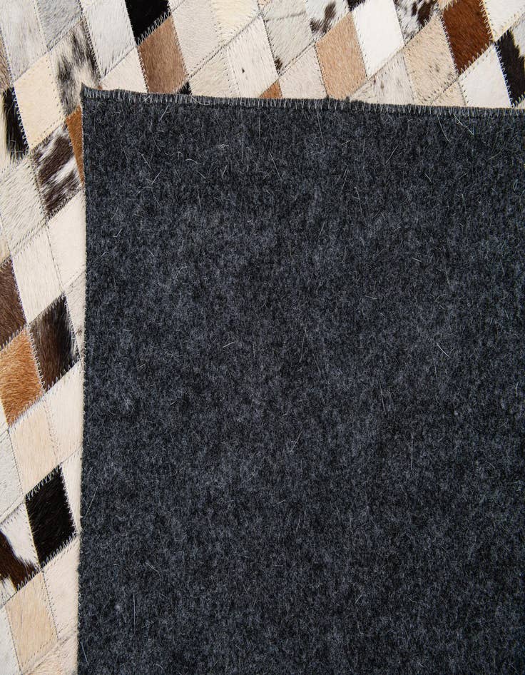 Detail image of  5' 1 x 7' 10 Cowhide Stocks Rug