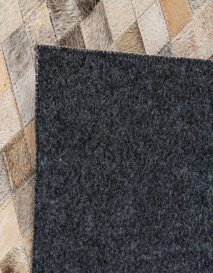 Detail image of  5' 2 x 7' 6 Cowhide Stocks Rug