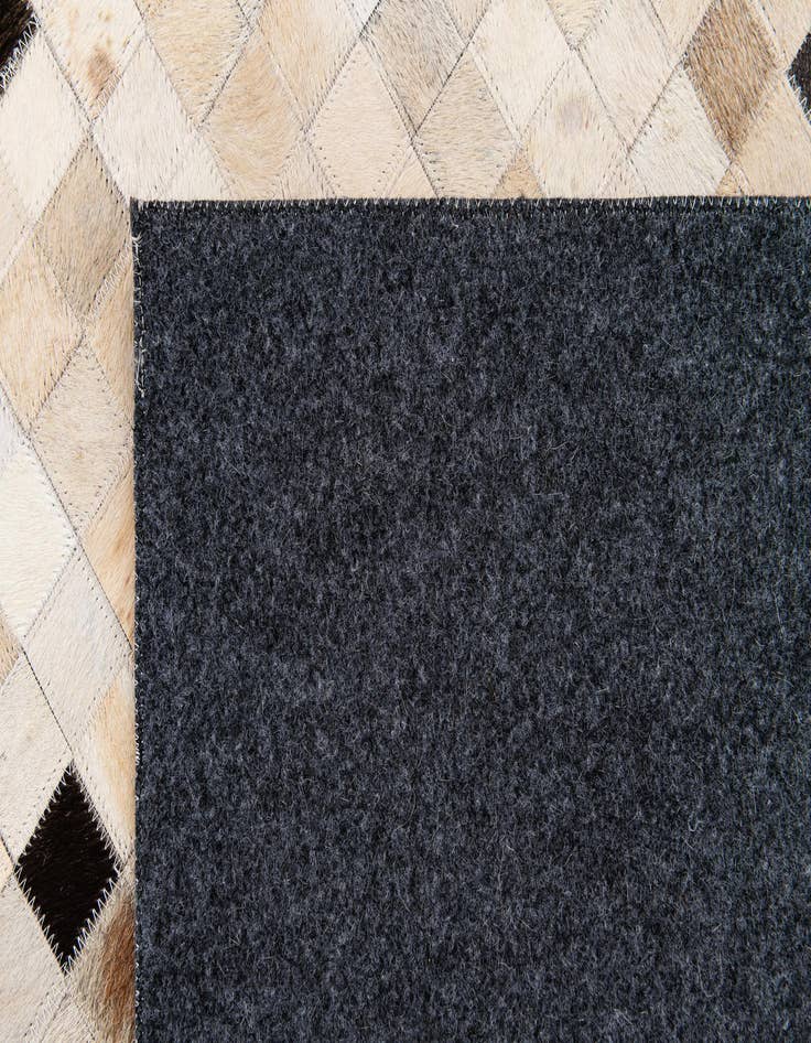 Detail image of  5' 4 x 7' 7 Cowhide Stocks Rug
