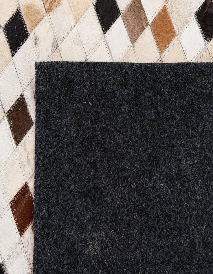 Detail image of  5' 2 x 8' Cowhide Stocks Rug