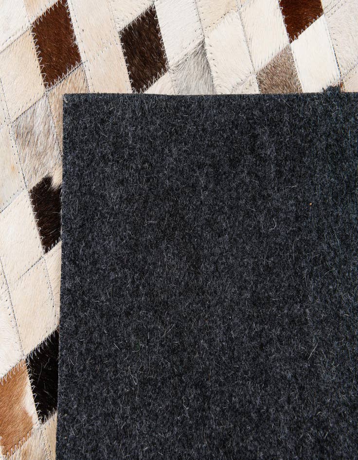 Detail image of  5' x 8' Cowhide Stocks Rug
