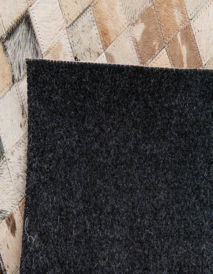 Detail image of  5' 1 x 8' Cowhide Stocks Rug