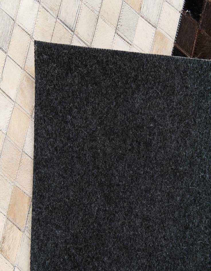 Detail image of  5' x 7' 11 Cowhide Stocks Rug