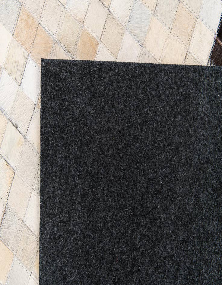 Detail image of  5' x 7' 11 Cowhide Stocks Rug