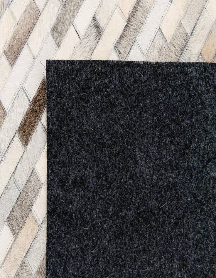 Detail image of  5' 9 x 7' 11 Cowhide Stocks Rug