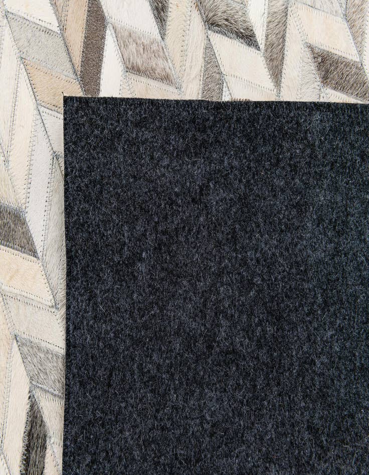 Detail image of  5' 9 x 8' 1 Cowhide Stocks Rug