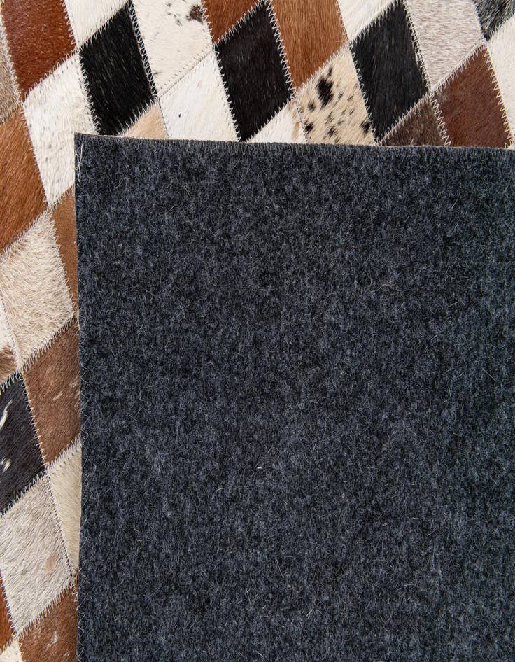 Detail image of  5' 1 x 7' 9 Cowhide Stocks Rug