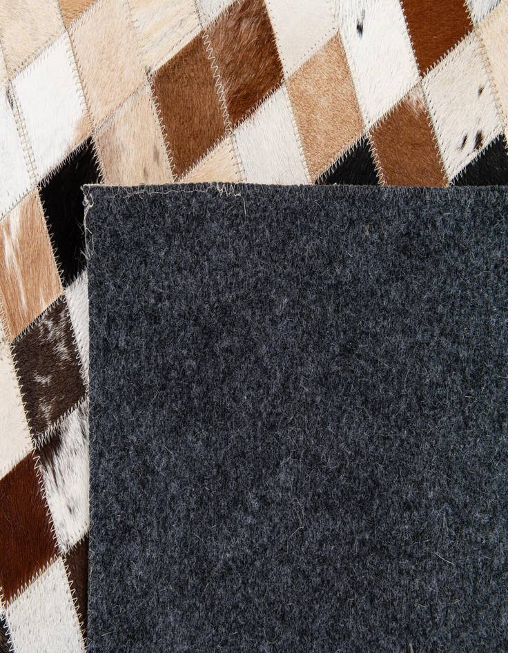 Detail image of  5' x 7' 11 Cowhide Stocks Rug