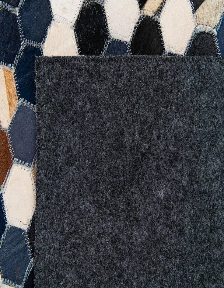 Detail image of  5' 1 x 8' Cowhide Stocks Rug
