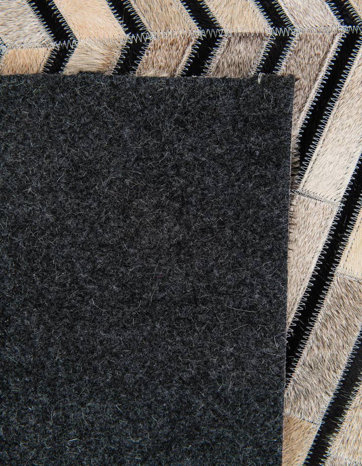 Detail image of  5' 1 x 8' Cowhide Stocks Rug