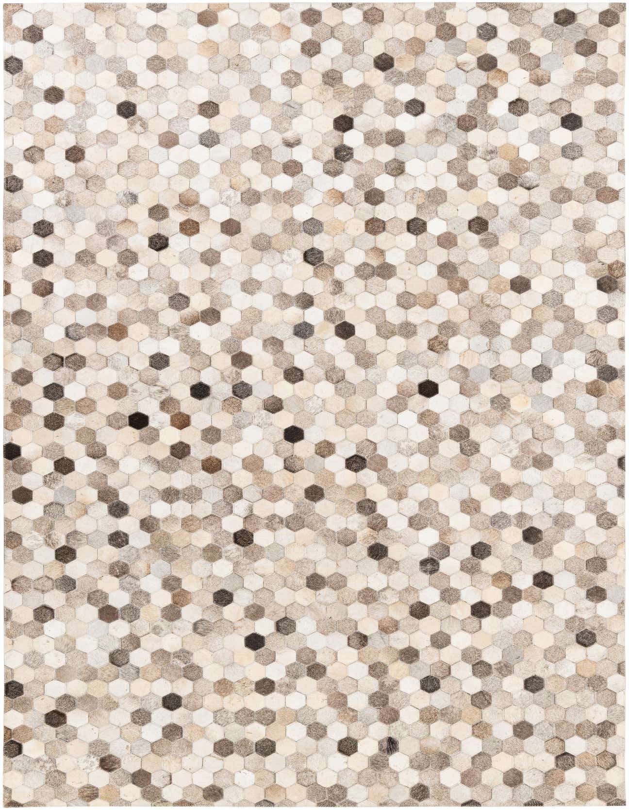 A 5x8 rectangular Cowhide Stocks rug featuring a modern hexagonal patchwork pattern in multi-colored natural cowhide and leather tones.