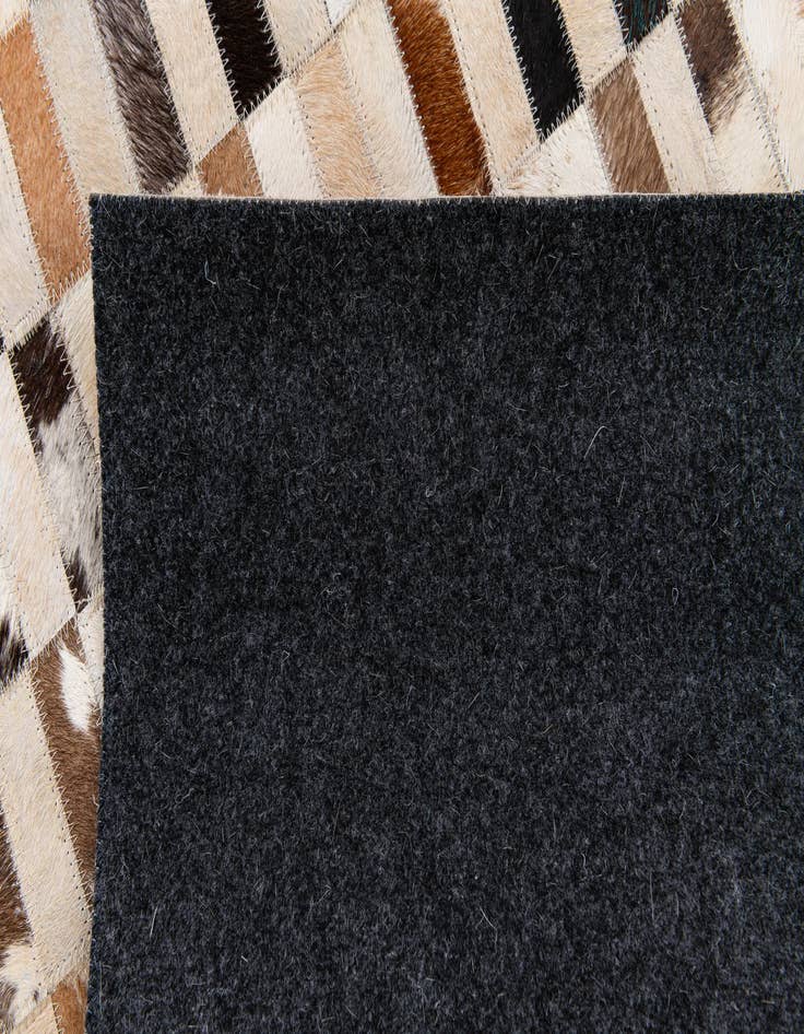 Detail image of  5' x 7' 9 Cowhide Stocks Rug