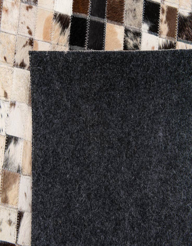 Detail image of  5' x 7' 11 Cowhide Stocks Rug