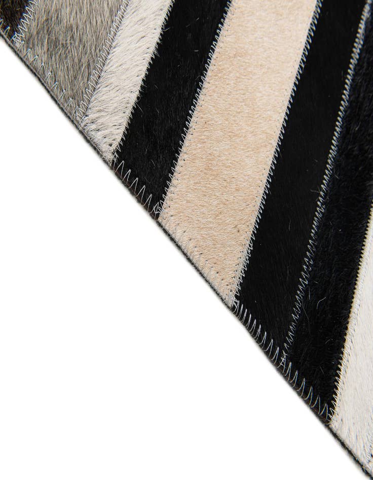 Detail image of  5' 1 x 7' 11 Cowhide Stocks Rug