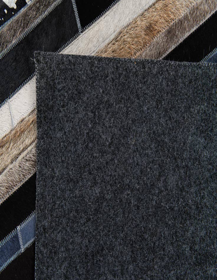 Detail image of  5' 1 x 7' 11 Cowhide Stocks Rug