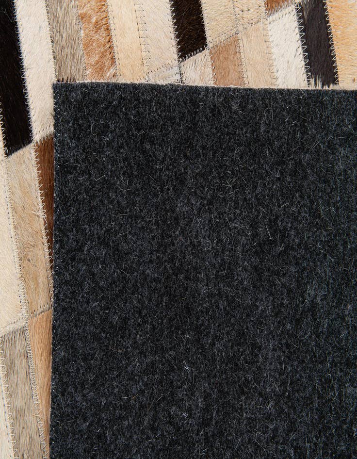 Detail image of  4' 11 x 7' 10 Cowhide Stocks Rug