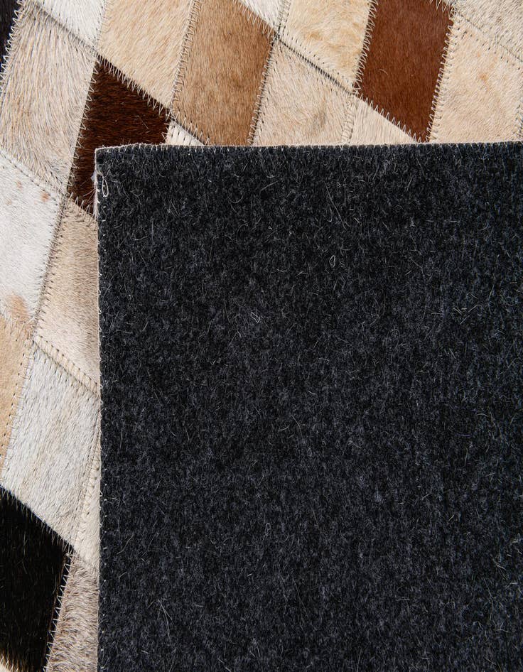 Detail image of  5' 1 x 7' 11 Cowhide Stocks Rug