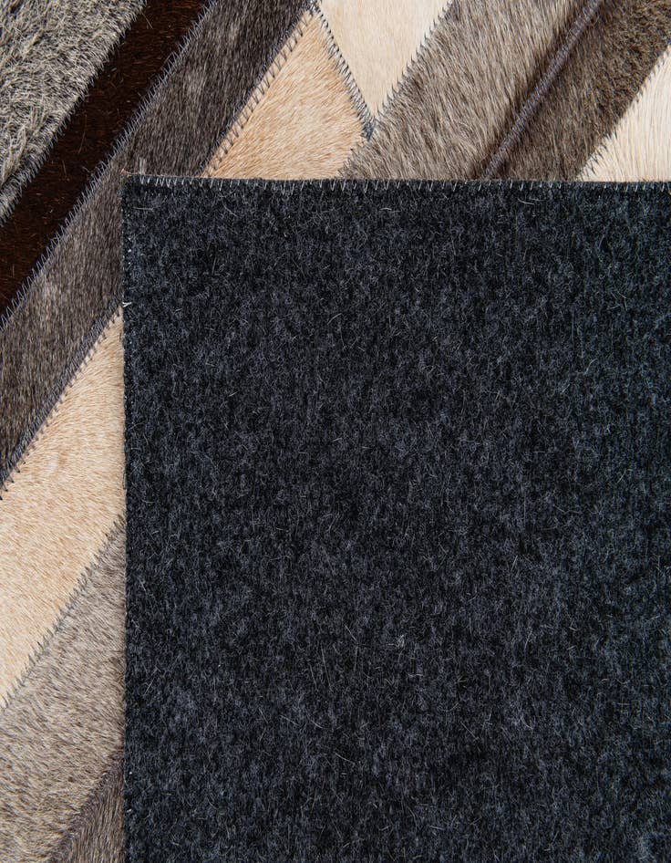 Detail image of  5' 1 x 8' Cowhide Stocks Rug