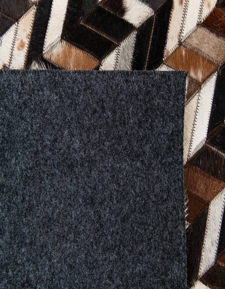 Detail image of  4' 11 x 8' Cowhide Stocks Rug