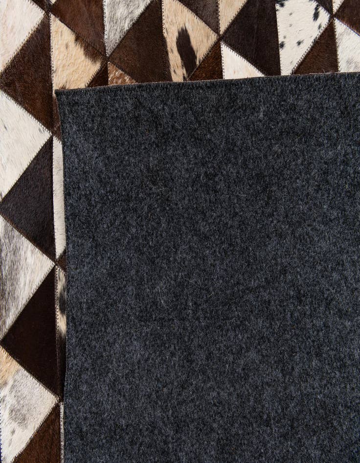 Detail image of  5' 1 x 8' 1 Cowhide Stocks Rug