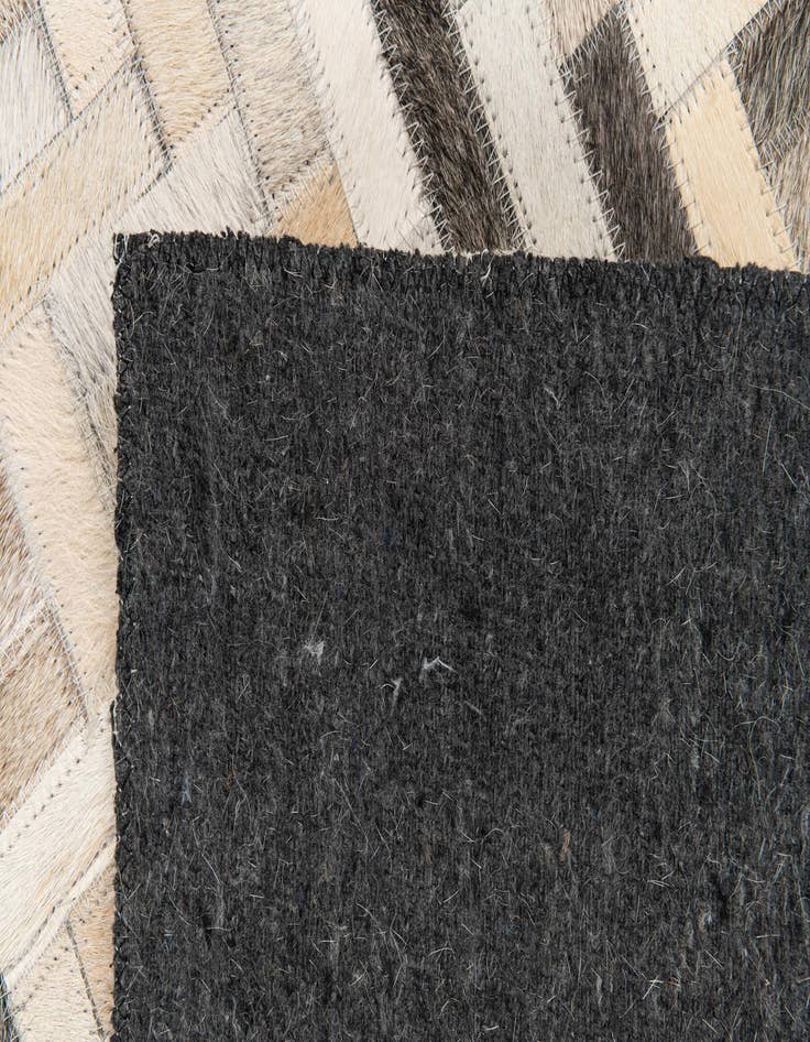 Detail image of  4' 10 x 7' 9 Cowhide Stocks Rug