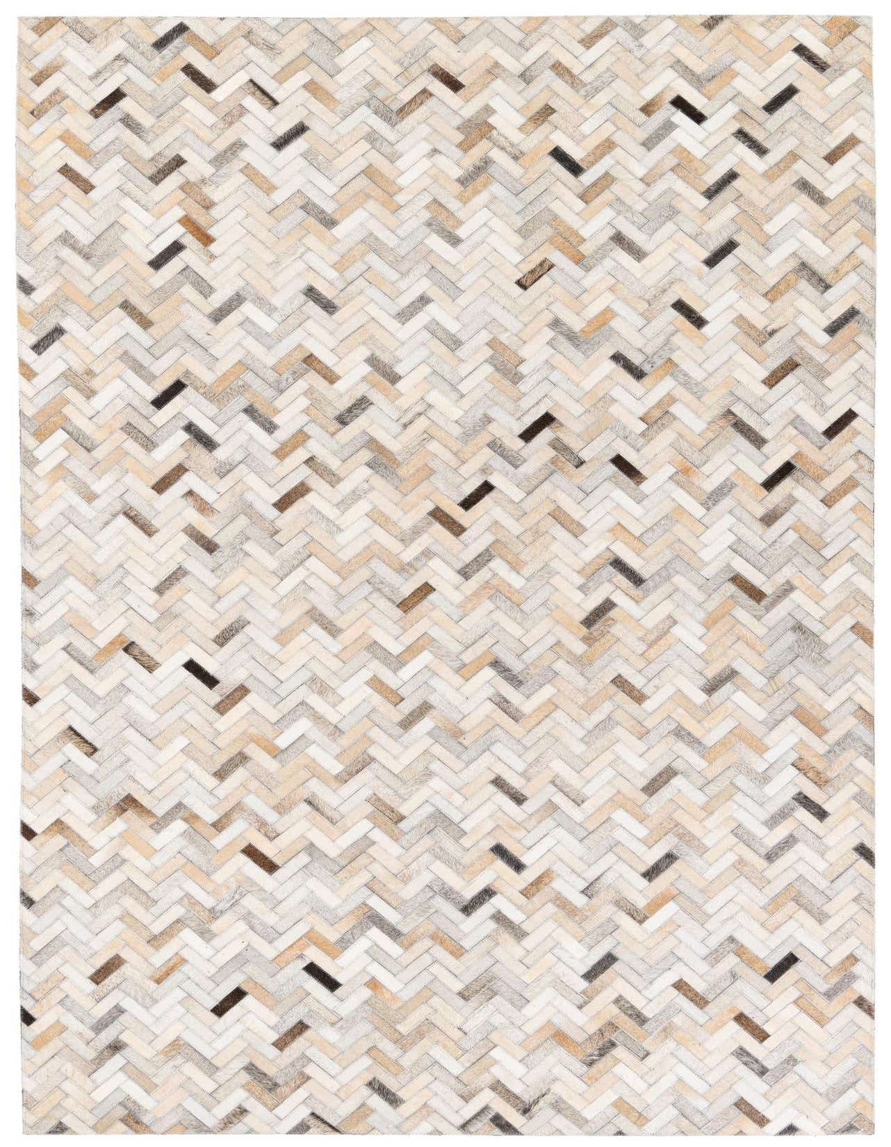 A rectangular 5x8 multi-colored cowhide rug with a modern chevron pattern, ideal for a living room.