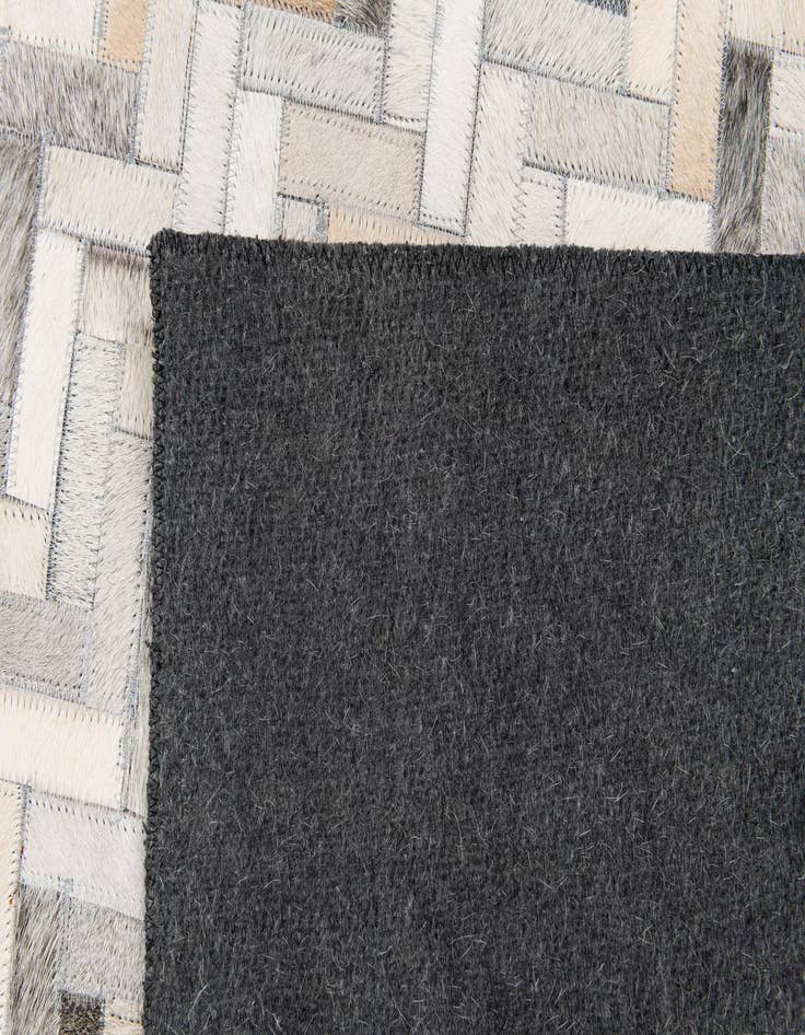 Detail image of  4' 10 x 7' 11 Cowhide Stocks Rug