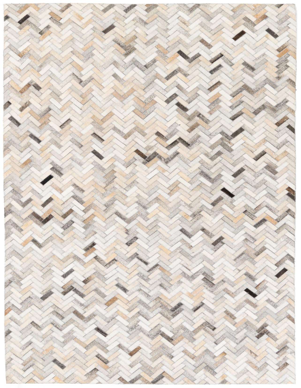 A rectangular 5x8 Cowhide Stocks rug from Rugs.com featuring a modern multi-colored herringbone pattern in natural tones.