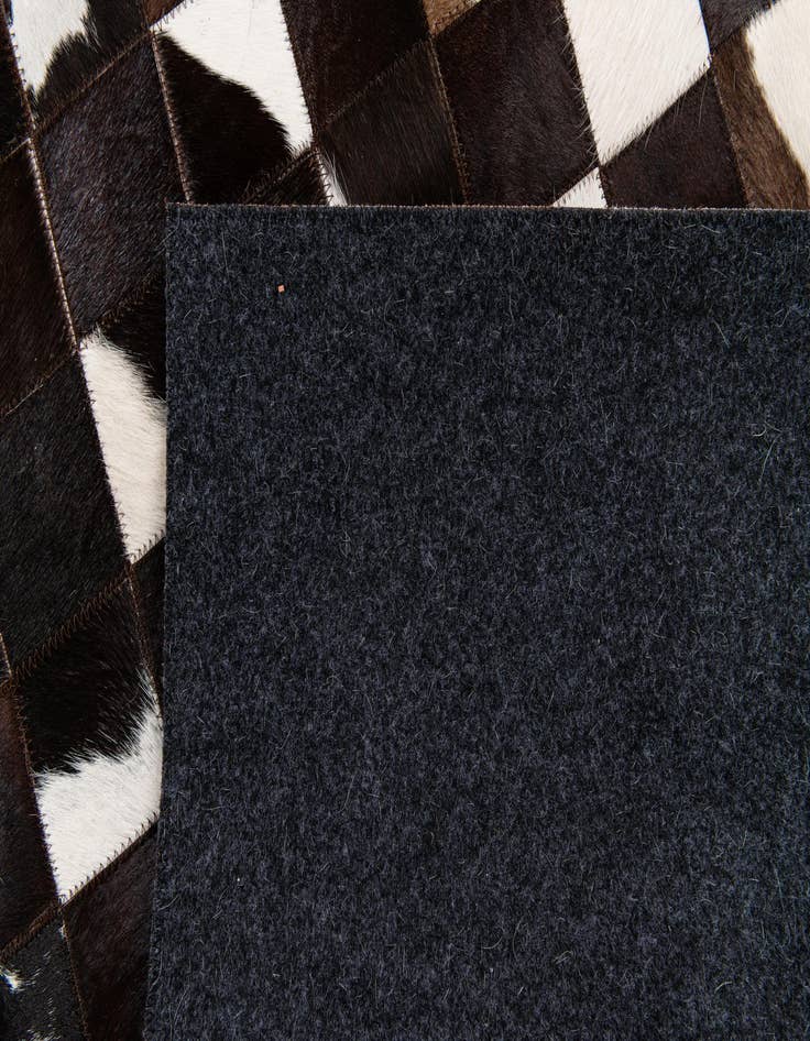 Detail image of  5' x 7' 11 Cowhide Stocks Rug