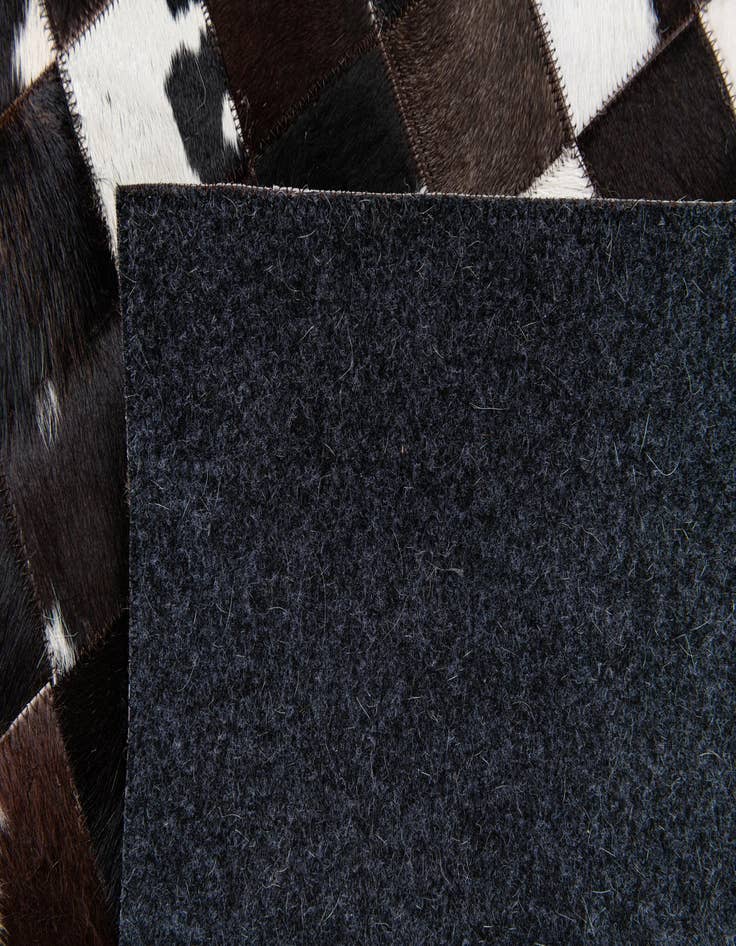 Detail image of  5' 1 x 8' Cowhide Stocks Rug