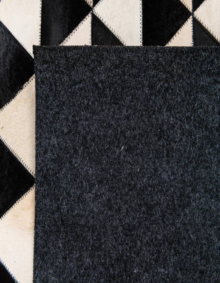 Detail image of  5' 1 x 8' 2 Cowhide Stocks Rug