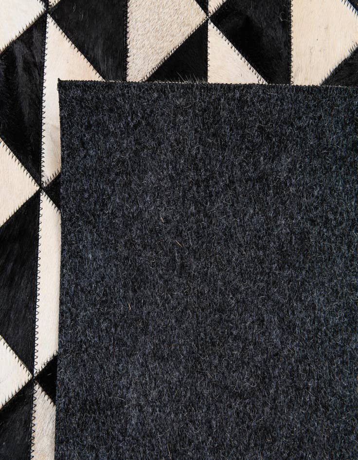 Detail image of  5' 1 x 8' 2 Cowhide Stocks Rug