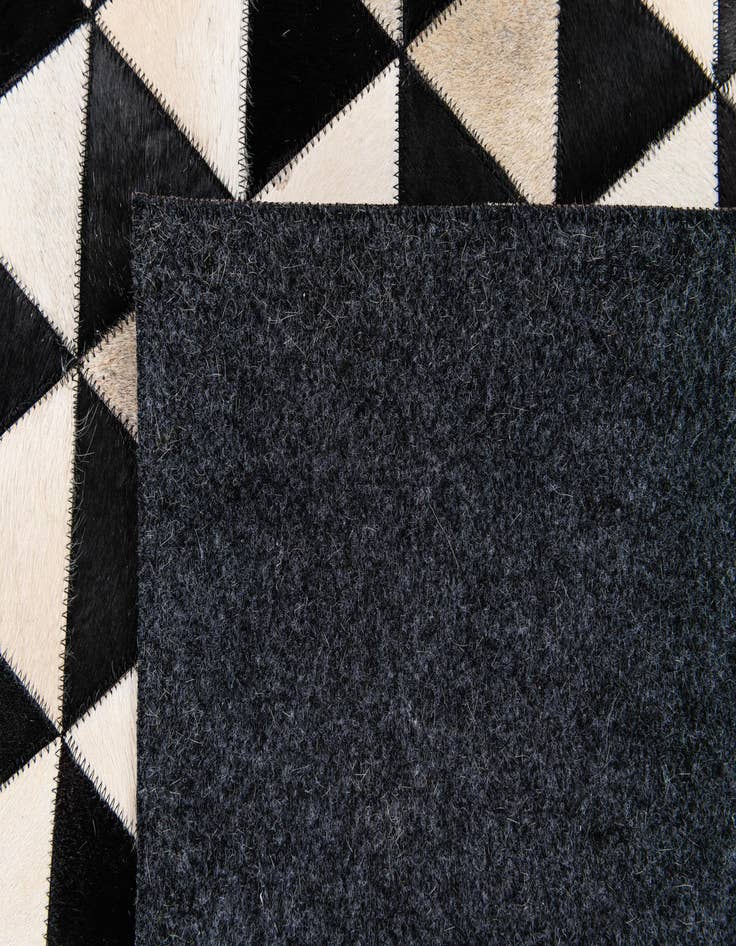 Detail image of  5' 1 x 8' 2 Cowhide Stocks Rug