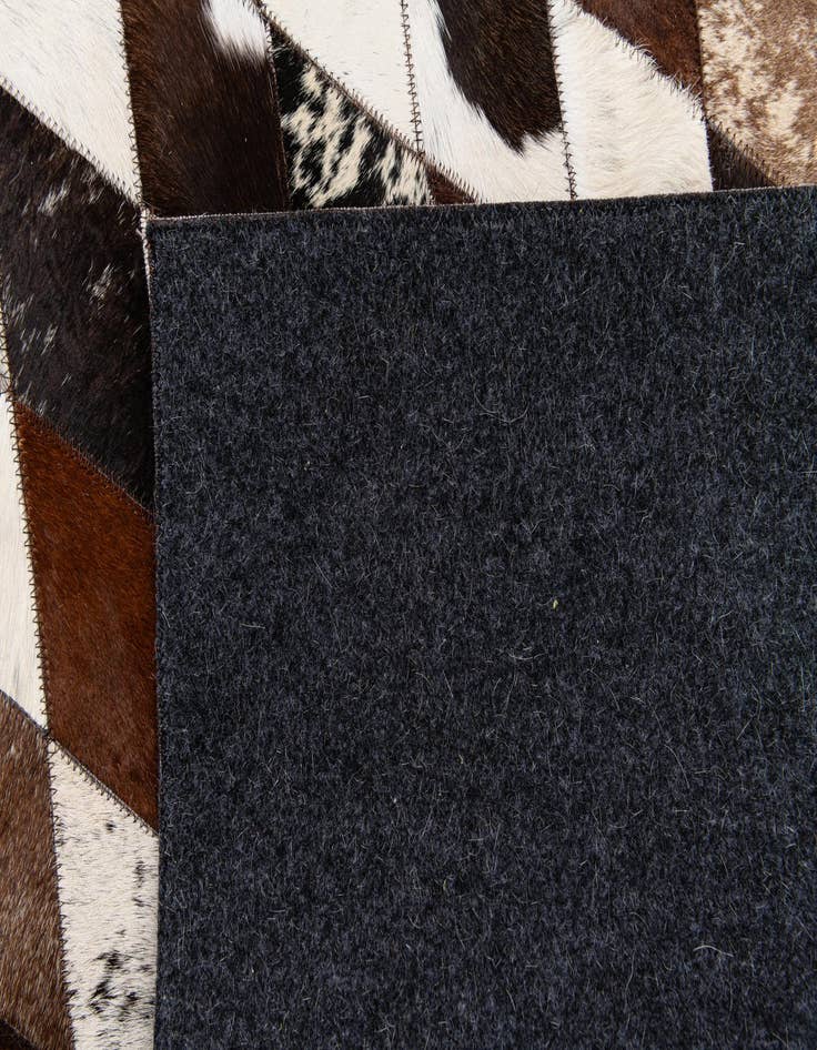 Detail image of  5' 7 x 8' Cowhide Stocks Rug