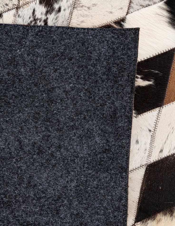 Detail image of  5' 7 x 8' Cowhide Stocks Rug