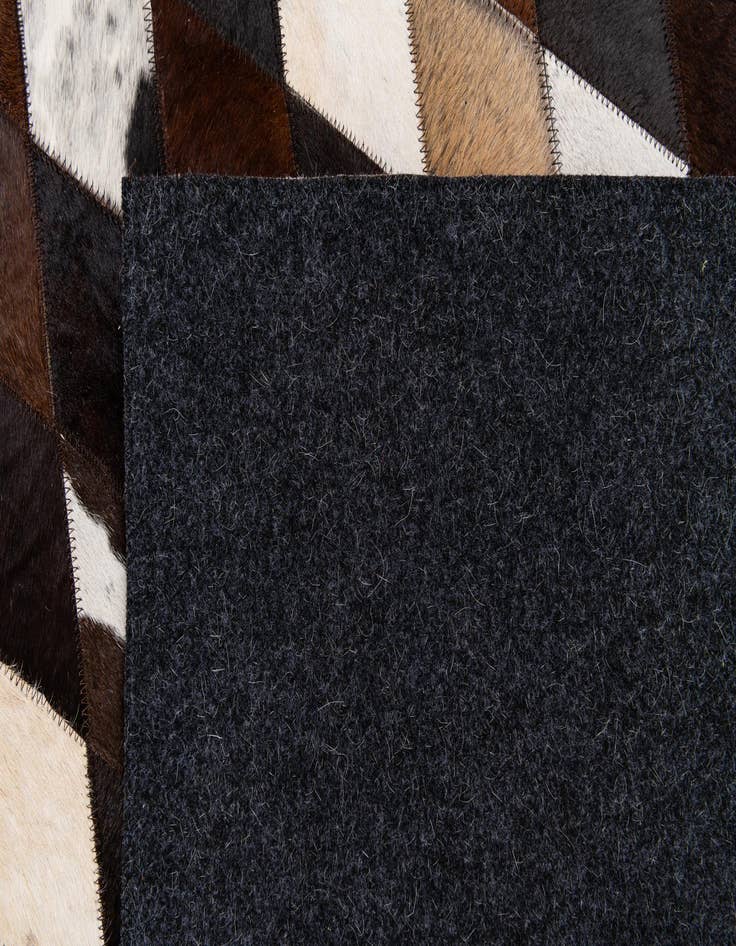 Detail image of  5' 2 x 8' 1 Cowhide Stocks Rug