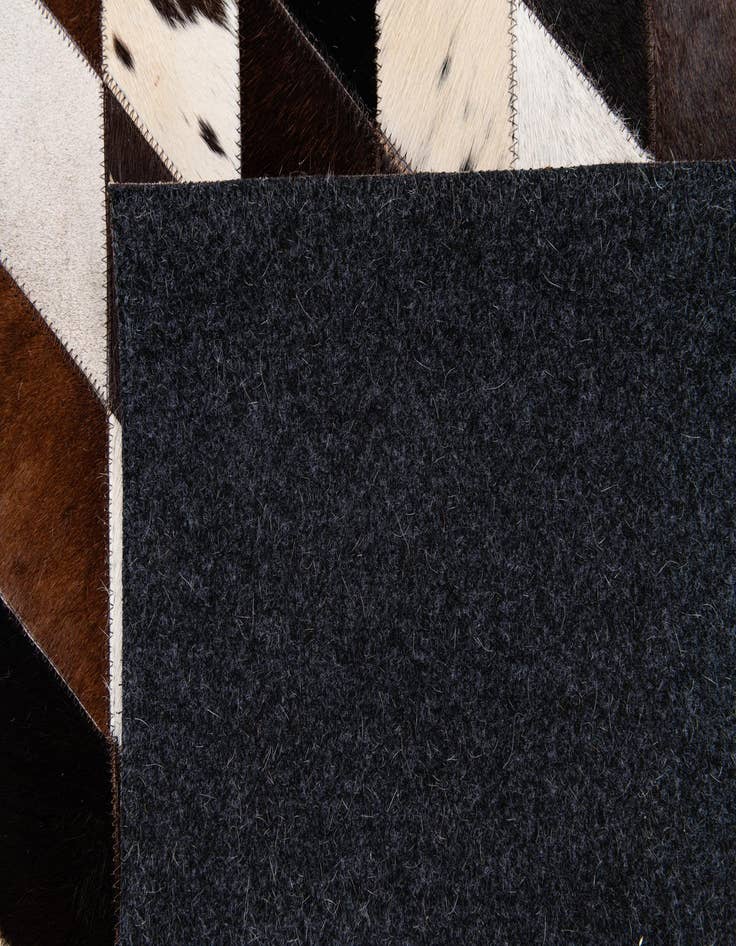 Detail image of  5' 3 x 8' Cowhide Stocks Rug